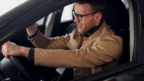 a handsome young man is furious because of a broken car while driving