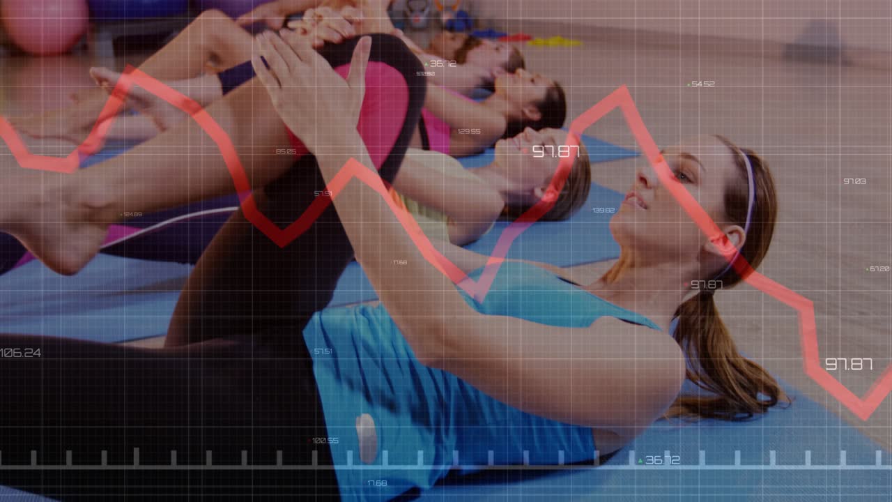 Foreground participant in blue tank leading knee lifts for core workout, red graph overlay tracking