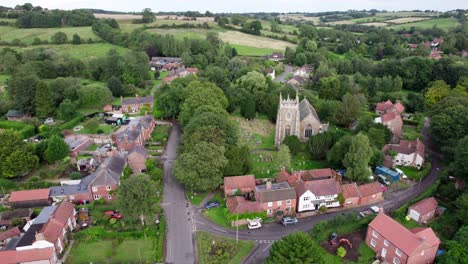 Aerial-video-footage-of-the-remains-of-Bolingbroke-Castle-a-13th-century-hexagonal-castle,-birthplace-of-the-future-King-Henry-IV,-with-adjacent-earthwork