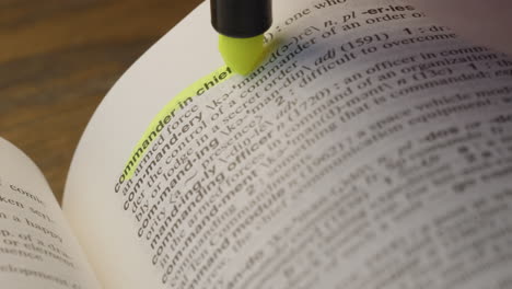 commander in chief politics dictionary highlighter concept, highlighting a word in a dictionary to show it's definition