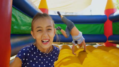 kids playing on the bouncing castle 4k