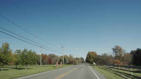 drive through the farming region, view from the car window. typical landscape with american farms