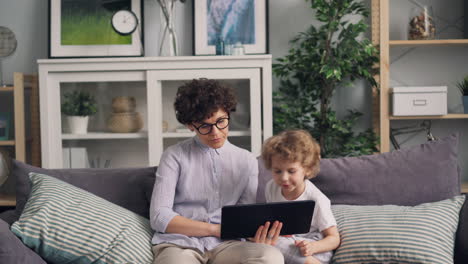 mother and child using a tablet at home