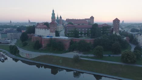 aerial drone shot of krakow poland wawel castle old town with the river vistula at sunrise