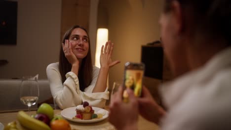 couple celebrating engagement at home dinner