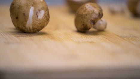 mushrooms falling out across a cuttingboard