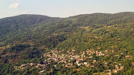 aerial flight over old isolated mountain village houses of kovachevitsa rhodopes bulgaria