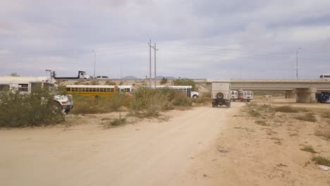 rv driving under a highway in cabo san lucas, baja california.