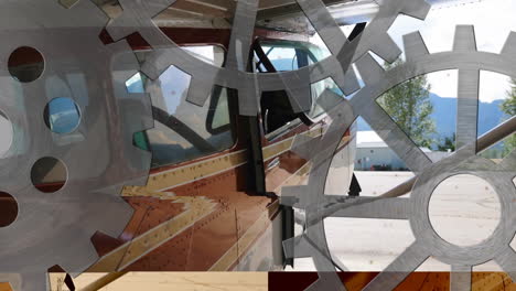 Airplane parked at airport with overlay of rotating gears animation