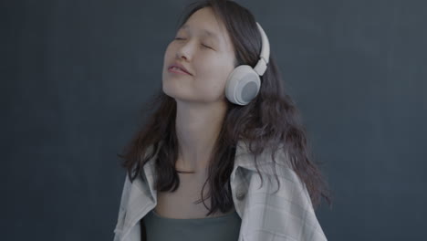 woman listening to music with headphones