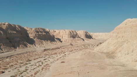 drone sails between mountain at judean desert