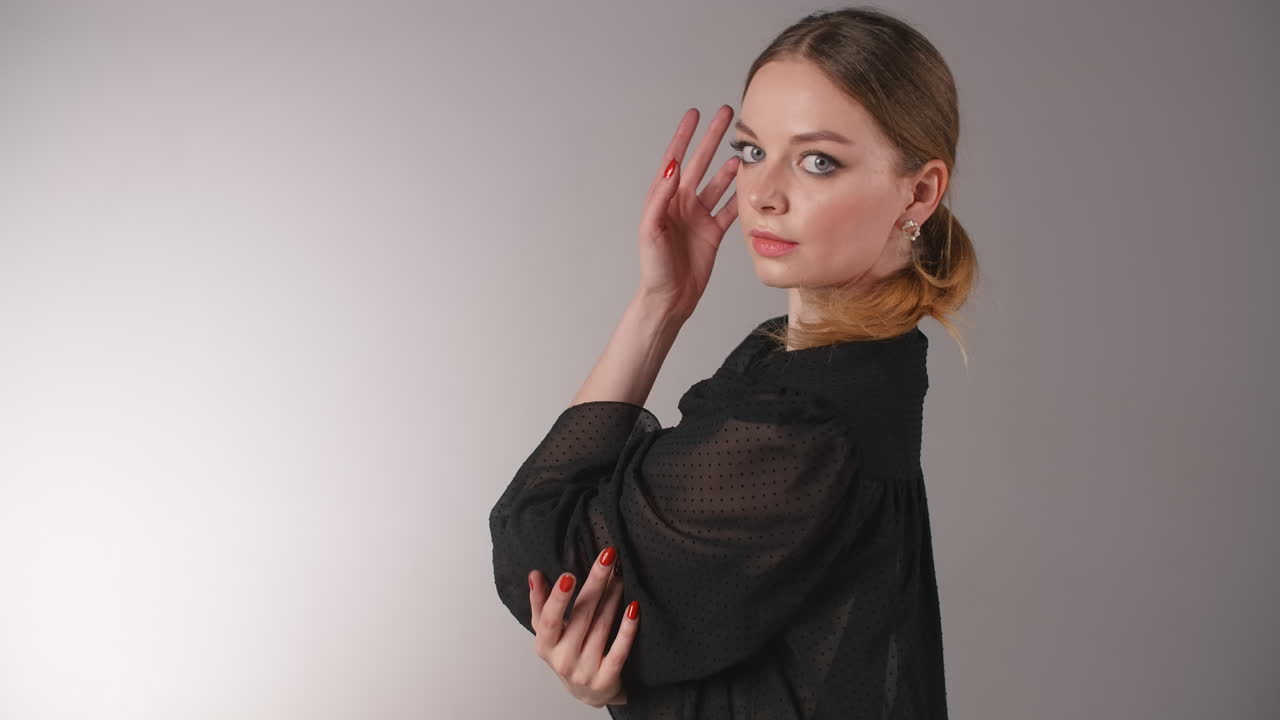Woman in Black Sheer Blouse Posing