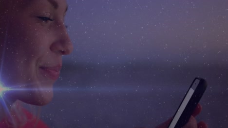 animation of social media icons with texts over caucasian woman using smartphone