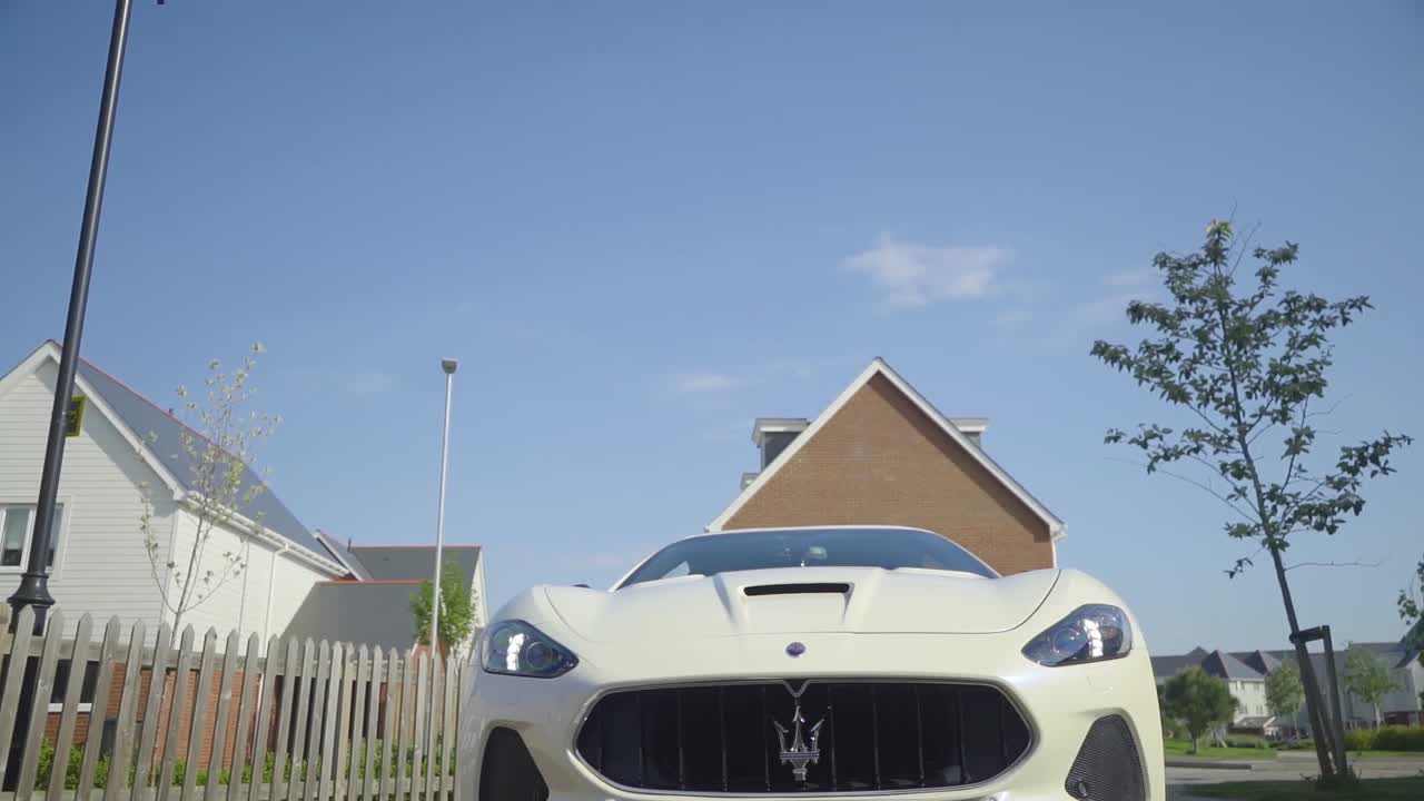 Slider shot of a Maserati front and sign