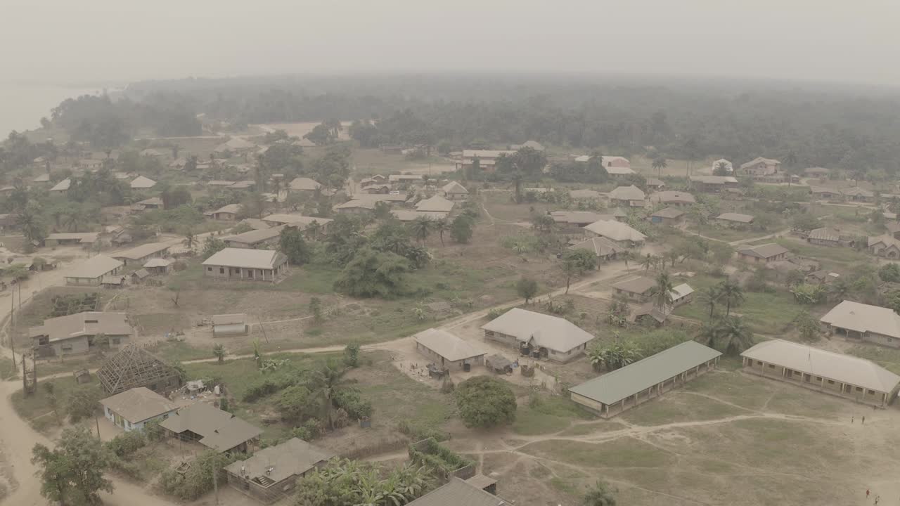 Aerial flyover shot of coastal tropical community