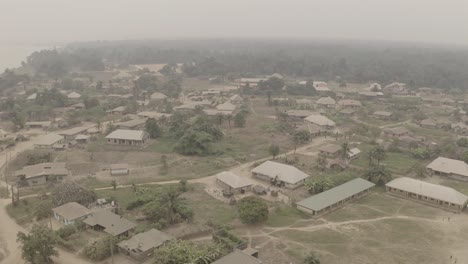 Aerial flyover shot of coastal tropical community