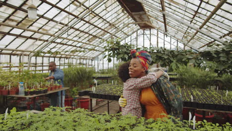 African-American-Boy-Hugging-Mother-in-Greenhouse