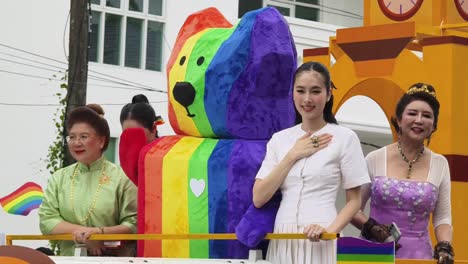 pride parade float with colorful costumes