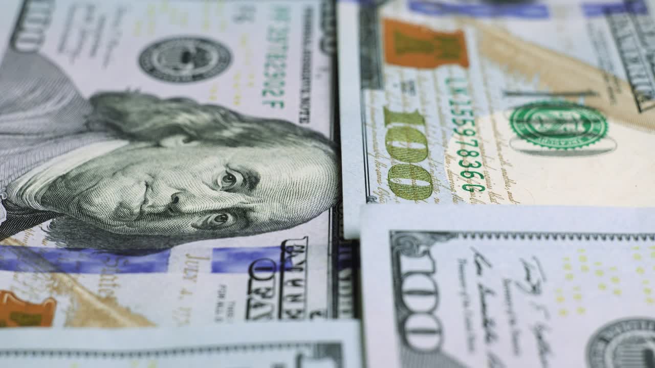 billetes de dólar estadounidense, dinero de papel, moneda de tasa de cambio. billetes de efectivo. el concepto de finanzas e inversión. cien dólares estadounidenses. economía empresarial