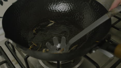 Frying-potato-shreds-in-hot-oil-inside-frying-pan