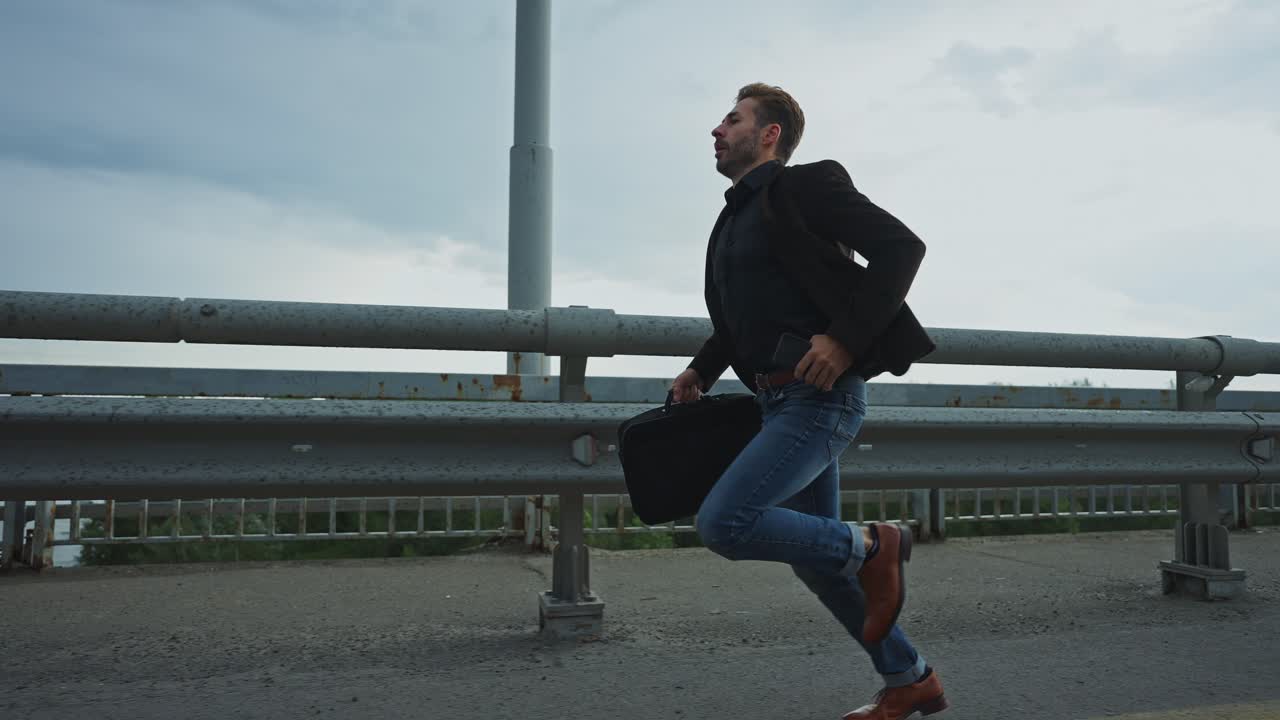Businessman Running Late on a Bridge