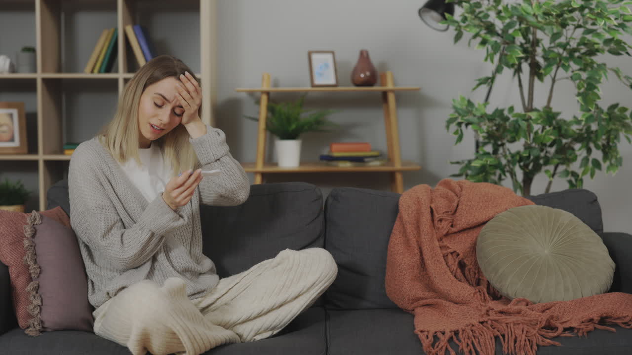 Woman reacting to a pregnancy test result