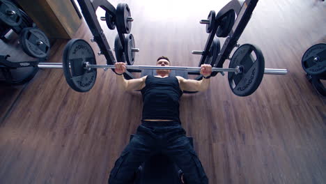 man doing deadlift exercise at gym. young man concentrated working at his perfect body