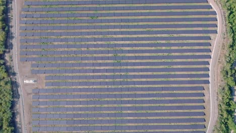 Aerial-top-down-shot-showing-texture-of-solar-panels-on-field-in-nature