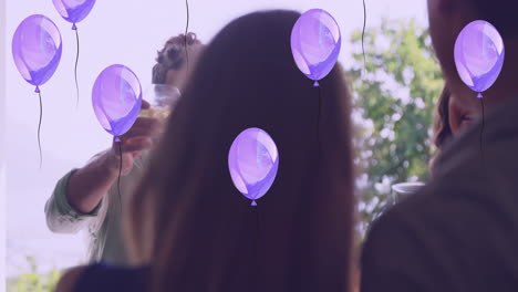 animation of balloons over happy diverse friends with drinks