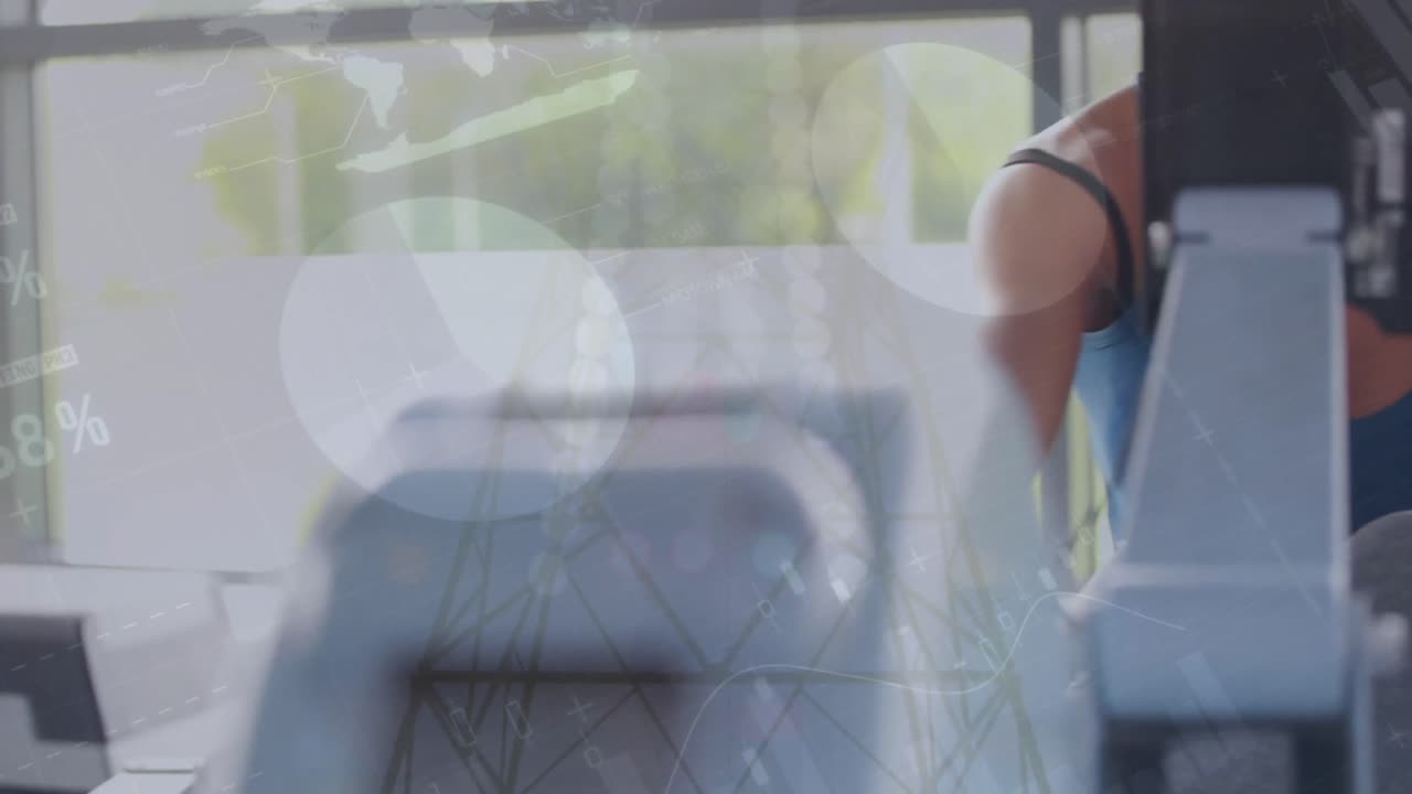 Animation of statistical data processing over caucasian fit woman using rowing machine at the gym