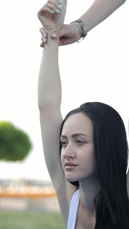 two sporty girls working out together outdoors doing fitness two sporty girls working out together outdoors doing fitness aerobics and stretching exercises in the park morning exercise