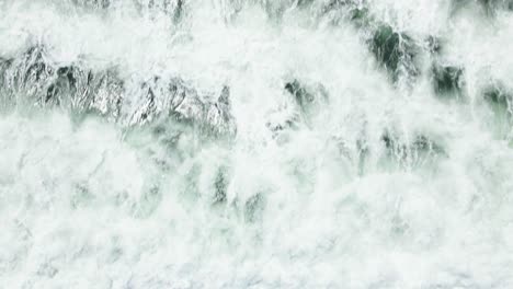 big waves crashing on surfers in south africa