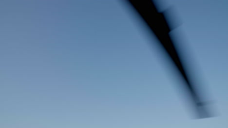 helicopter propellers rotating against blue sky background