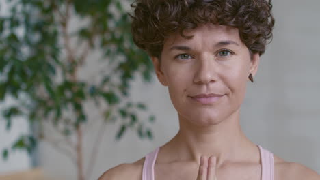 woman meditating in yoga pose