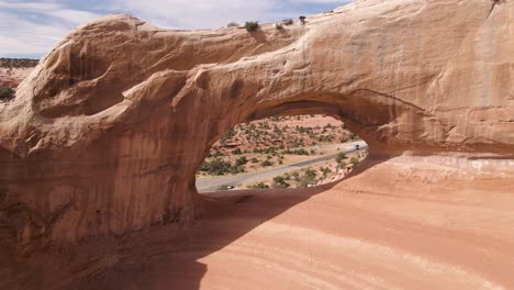 Drone-approach-of-Wilson-Arch-natural-rock-formation-in-Utah