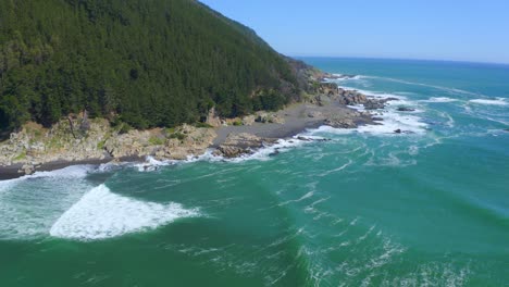 port-or-caleta-maguellines,-constitucion-chile-drone-shot-sunny-day-with-fishing-boats-surf-spot