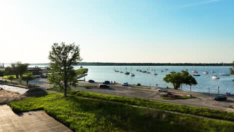 sailboats anchored in harbor in muskegon lake