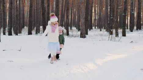 two carefree little girls running through the winter forest 4k slow motion video