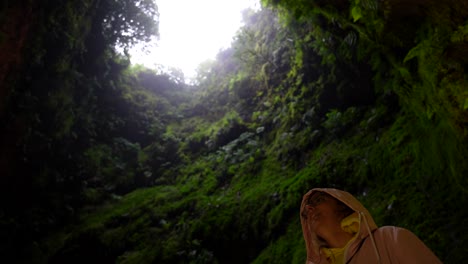 Woman-smiling-for-visiting-the-interior-of-Algar-do-Carvao-lava-tunnel