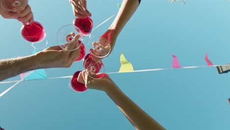 friends toasting with wine outdoors