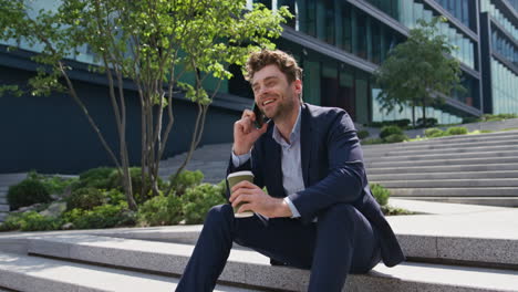 manager enjoy smartphone conversation sitting street stairs at break close up.
