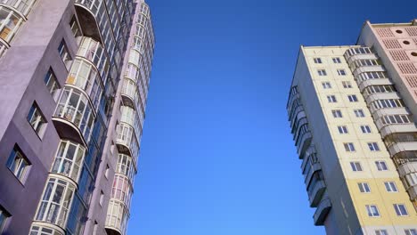 new multi-storey houses. residential building on blue sky background. urban scene.