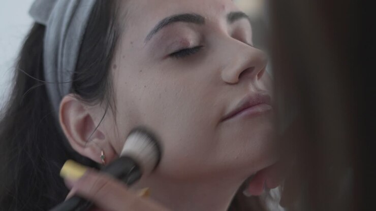 Woman Getting Makeup Applied