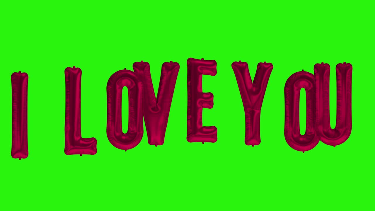 palabras te quiero de helio letras de globo de papel de aluminio rojo flotando en la pantalla verde