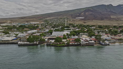 Lahaina-Maui-Hawaii-Aerial-v6-reverse-fly-away-from-coastal-town-capturing-townscape,-foothill-farm-estates-and-spectacular-Puʻu-Kukui-volcanic-mountain-views---Shot-with-Mavic-3-Cine---December-2022