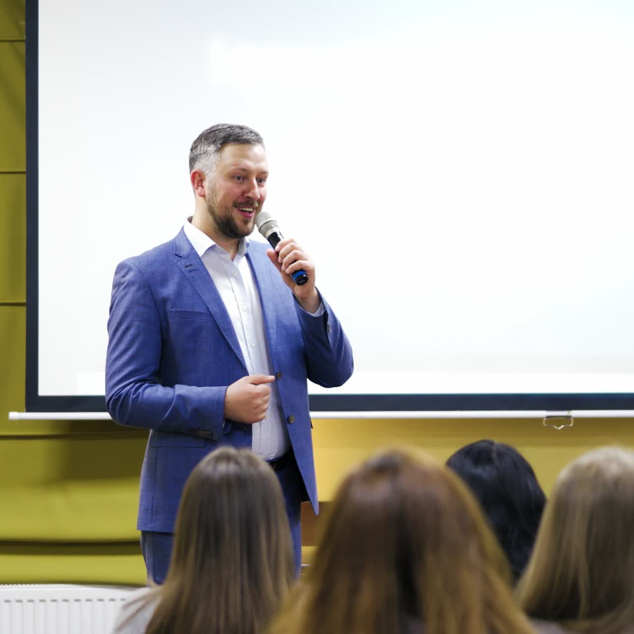 Young people listening to speaker