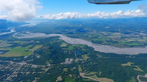 airplane flight east of palmer alaska with the town, matanuska river and palmer airport in the distance