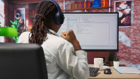 excited programmer testing code on pc, clapping hands after positive result