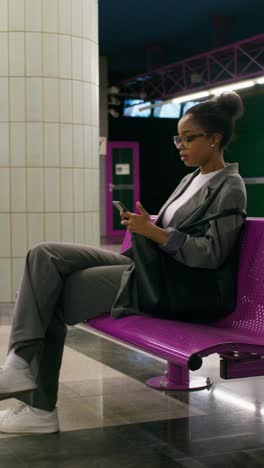 woman waiting at a metro station