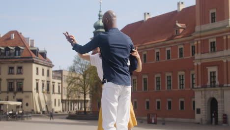 interracial couple dancing salsa in the old town street